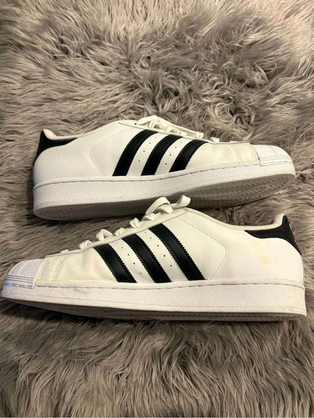 adidas Men’s White Shell Toe Sneakers with Black Three-Stripes